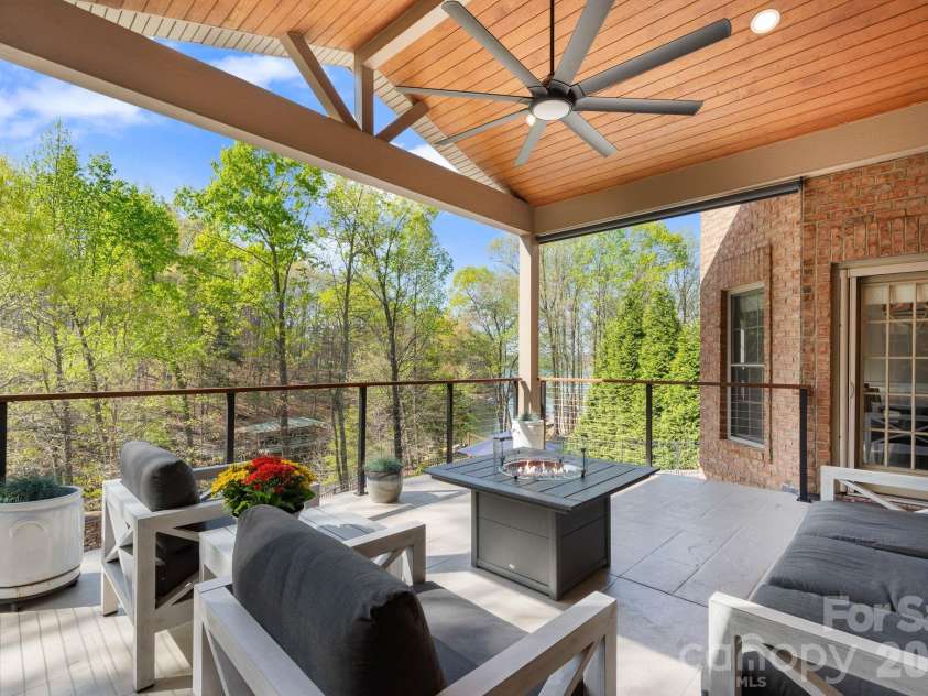 183 April Road, Troutman, NC 28166.  MLS# CAR4365014, YatesRealty ID 12908. Covered deck on main level with fireplace
