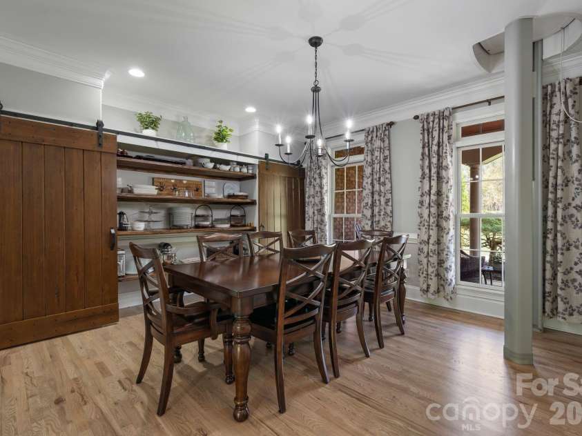 183 April Road, Troutman, NC 28166.  MLS# CAR4365014, YatesRealty ID 12908. Formal dining with hidden buffet behind bar doors