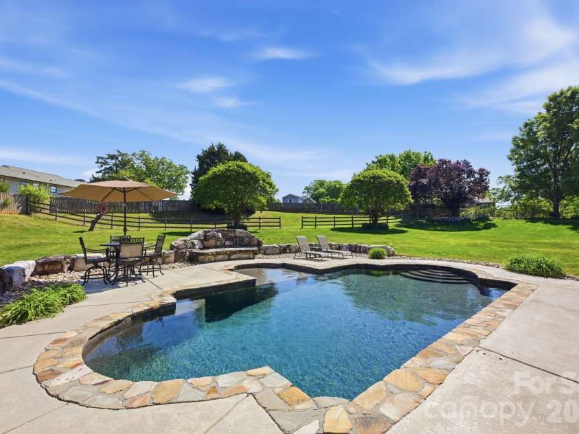 145 Blue Grass Circle, Mooresville, NC 28117.  MLS# CAR4369694, YatesRealty ID 12910. Back Yard Oasis with Pool