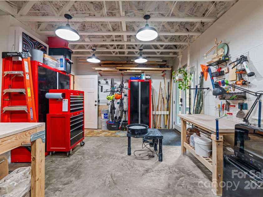 123 Brucemont Circle, Asheville, NC 28806.  MLS# CAR4243133, YatesRealty ID 12914. Spacious workshop in basement with interior and exterior access