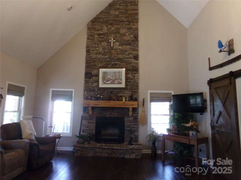 7218 Alexander Farm Road, Monroe, NC 28110.  MLS# CAR4238823, YatesRealty ID 12919. Living room fireplace