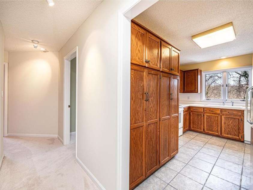 2231 6th Street, Hickory, NC 28601.  MLS# CAR4421162, YatesRealty ID 12920. Hall to 2 guest bedrooms and bath