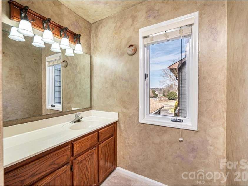 2231 6th Street, Hickory, NC 28601.  MLS# CAR4421162, YatesRealty ID 12920. Primary bath has a separate sink and toilet/shower area making it easy to share the space!