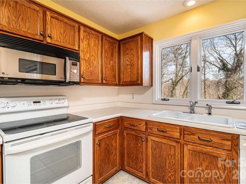 2231 6th Street, Hickory, NC 28601.  MLS# CAR4421162, YatesRealty ID 12920. The kitchen window overlooks the pool!