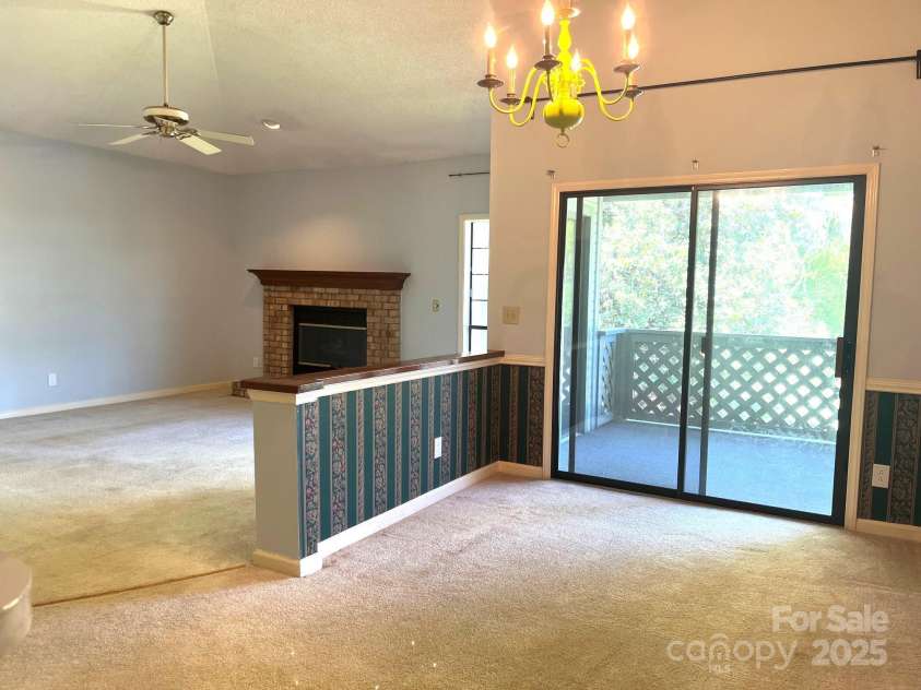 5810 Harris Grove Lane, Charlotte, NC 28212.  MLS# CAR4246462, YatesRealty ID 12922. Taken at dining room looking back to living room