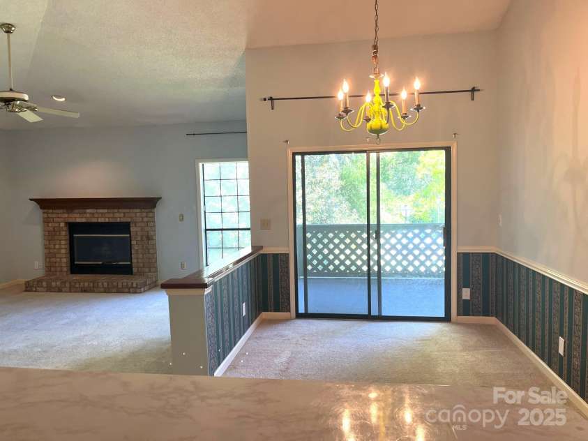 5810 Harris Grove Lane, Charlotte, NC 28212.  MLS# CAR4246462, YatesRealty ID 12922. Taken from kitchen toward dining room and living room