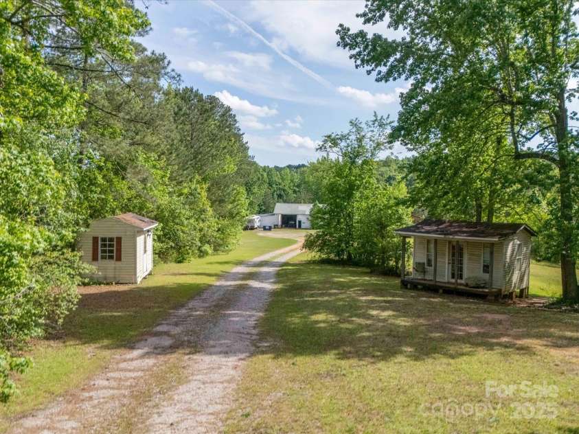 464 Ingram Road, Lilesville, NC 28091.  MLS# CAR4255334, YatesRealty ID 12931. Road to Barn