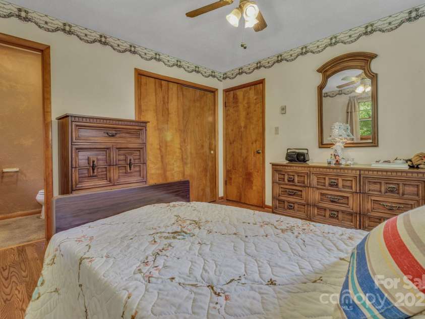 676 Arrowhead Trail, Marion, NC 28752.  MLS# CAR4252905, YatesRealty ID 12932. Primary bedroom with half bath