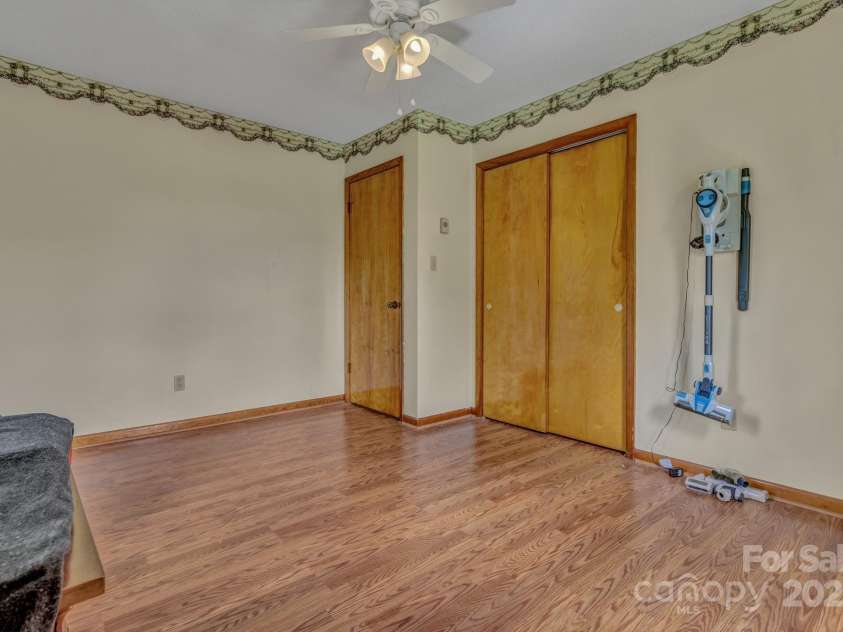 676 Arrowhead Trail, Marion, NC 28752.  MLS# CAR4252905, YatesRealty ID 12932. This bedroom has a washer and dryer hook up that the owner used instead of having to go into the basement which also has a wash dryer hook up.