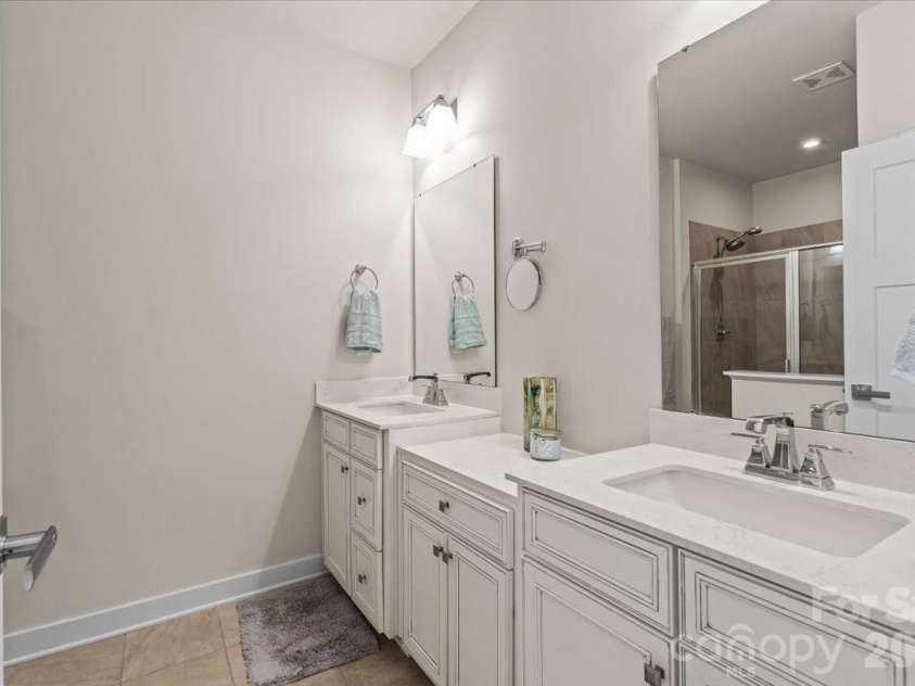 606 Crudent Road, Tega Cay, SC 29708.  MLS# CAR4360314, YatesRealty ID 12935. Owner's Bathroom Dual Sinks