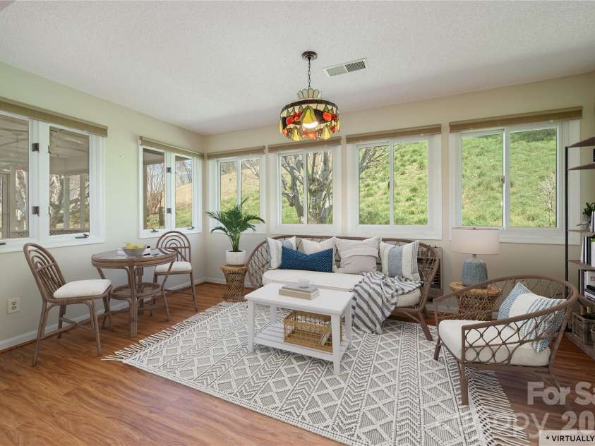 176 Derbyshire Drive, Hendersonville, NC 28792.  MLS# CAR4362871, YatesRealty ID 12938. Sunroom
