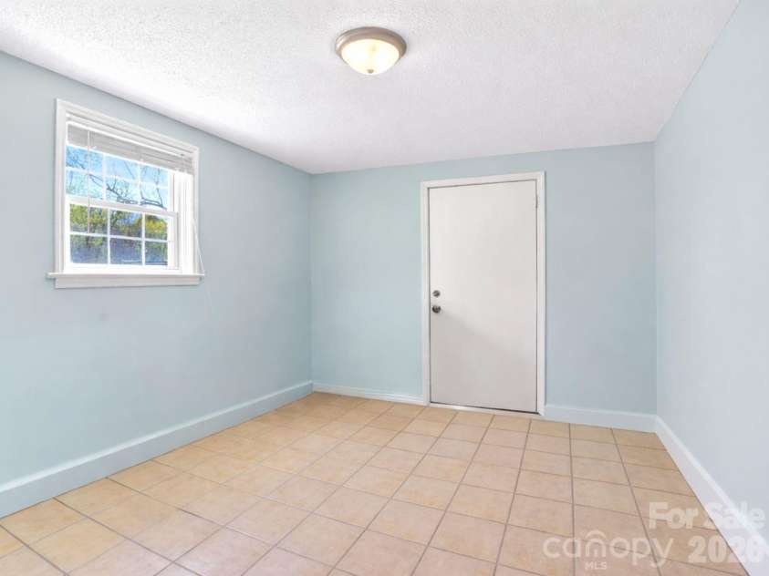 1091 16th Avenue, Hickory, NC 28601.  MLS# CAR4363676, YatesRealty ID 12939. Direct exterior access  - could be used as a 4th bedroom if needed - no closet but does have egress