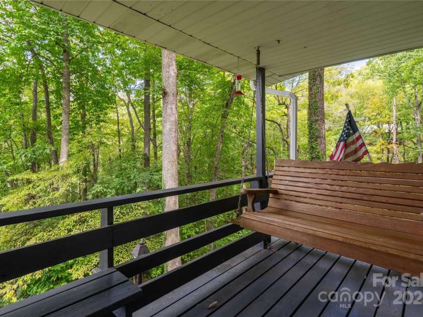 330 Overlook Drive, Maggie Valley, NC 28751.  MLS# CAR4300696, YatesRealty ID 1294. Deck off the left of living room