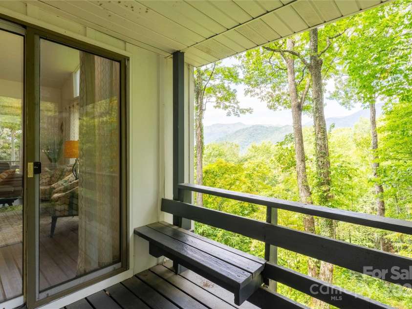 330 Overlook Drive, Maggie Valley, NC 28751.  MLS# CAR4300696, YatesRealty ID 1294. Deck off the left of living room