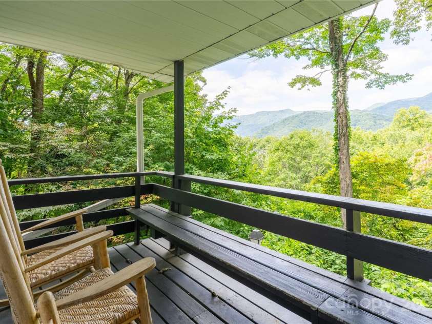 330 Overlook Drive, Maggie Valley, NC 28751.  MLS# CAR4300696, YatesRealty ID 1294. Deck off the right of living room