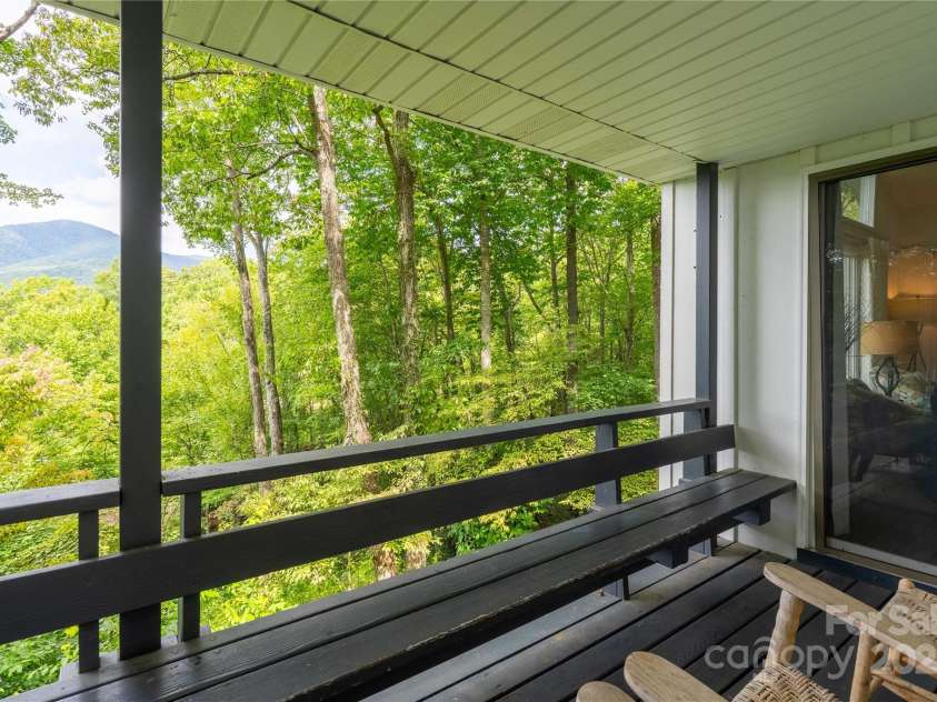 330 Overlook Drive, Maggie Valley, NC 28751.  MLS# CAR4300696, YatesRealty ID 1294. Deck off the right of living room