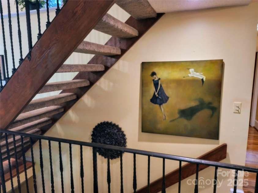 31 Cedarwood Lane, Asheville, NC 28803.  MLS# CAR4126621, YatesRealty ID 12943. Custom Iron railings on modern floating stairs