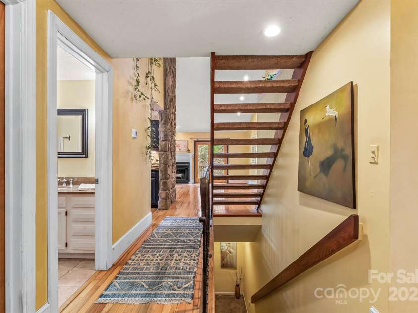 31 Cedarwood Lane, Asheville, NC 28803.  MLS# CAR4126621, YatesRealty ID 12943. Entry View of floating stairs