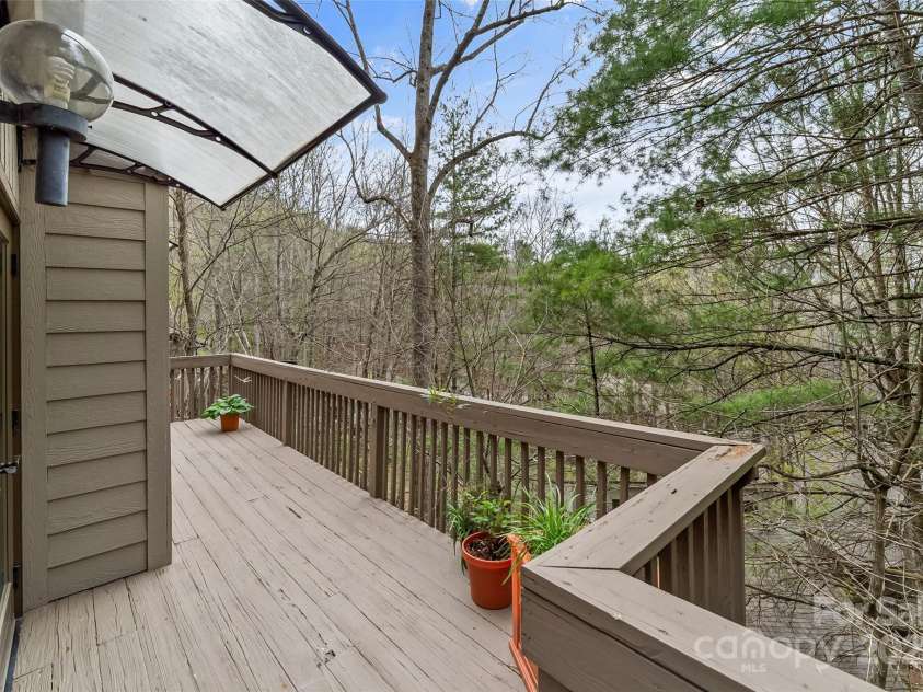 31 Cedarwood Lane, Asheville, NC 28803.  MLS# CAR4126621, YatesRealty ID 12943. View from back deck - Exterior of home and all decking slated to be painted in 2025