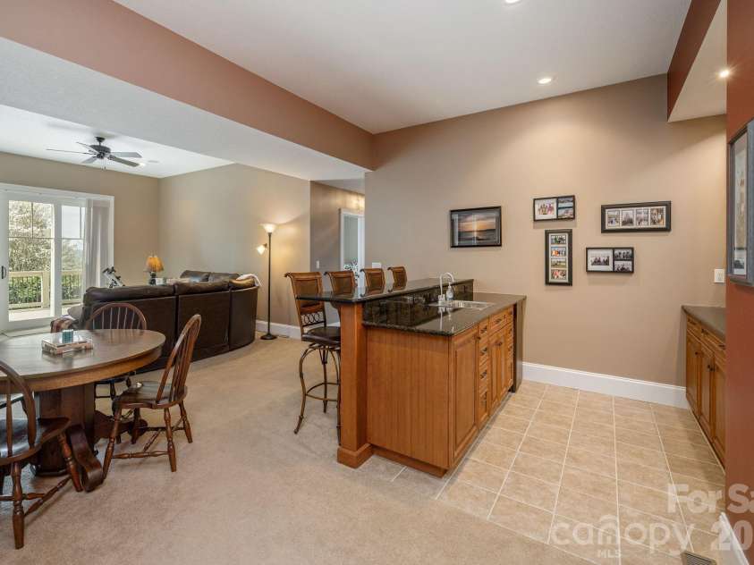 315 Crossvine Trail, Hendersonville, NC 28739.  MLS# CAR4367109, YatesRealty ID 12946. Lower level wet bar with refrigerator