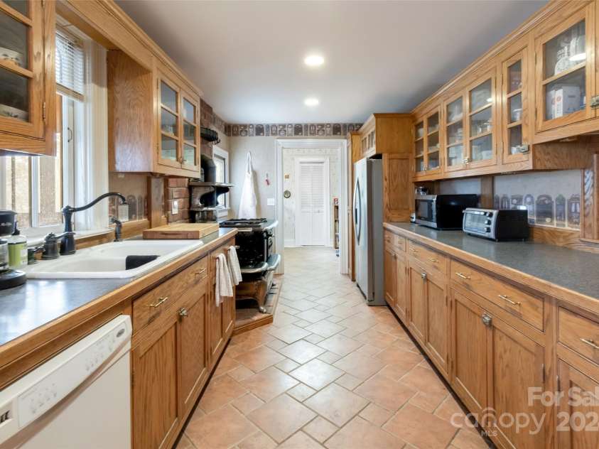 759 and 755 Snelson Road, Marshall, NC 28753.  MLS# CAR4186627, YatesRealty ID 1295. Kitchen main house handcrafted cabinets
