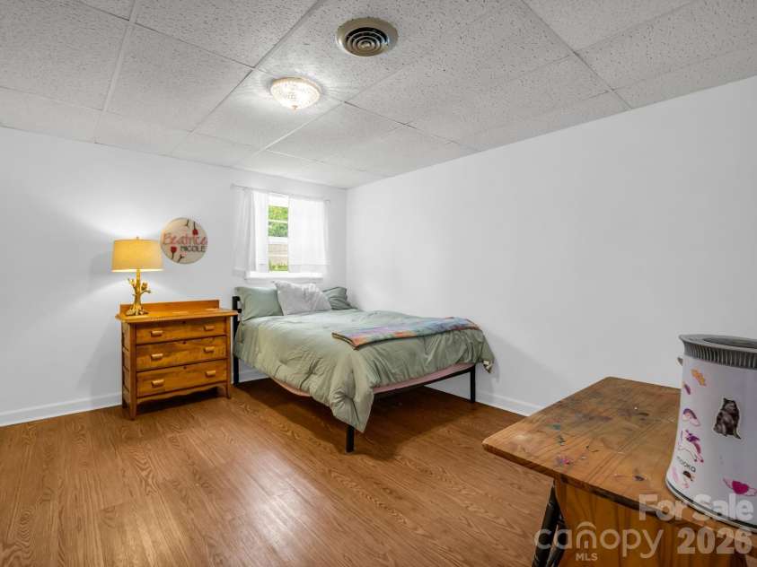 54 Broadway Avenue, Tryon, NC 28782.  MLS# CAR4357107, YatesRealty ID 12954. Bedroom in Basement