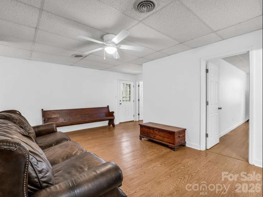 54 Broadway Avenue, Tryon, NC 28782.  MLS# CAR4357107, YatesRealty ID 12954. Den Area in Basement