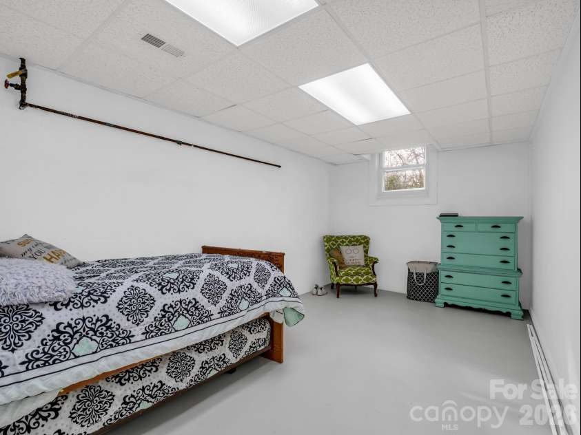 54 Broadway Avenue, Tryon, NC 28782.  MLS# CAR4357107, YatesRealty ID 12954. Flex Room currenty being used as a bedroom