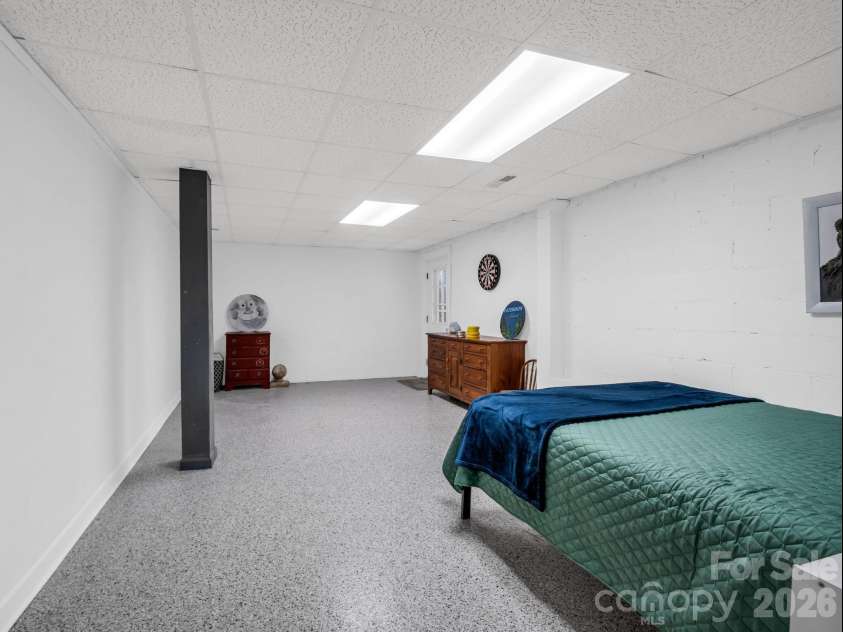 54 Broadway Avenue, Tryon, NC 28782.  MLS# CAR4357107, YatesRealty ID 12954. Large Recreation Room currently being used as a bedroom