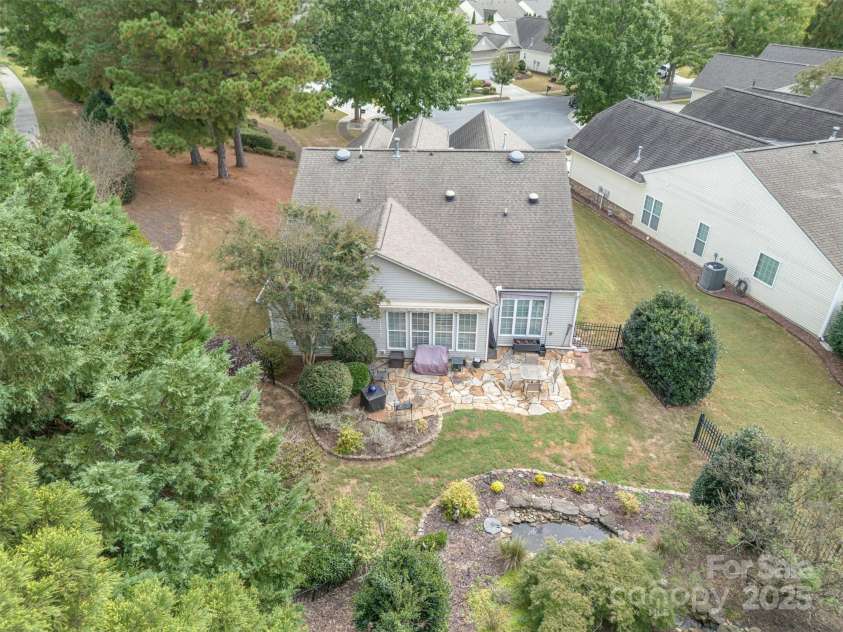 43041 Mimosa Court, Fort Mill, SC 29707.  MLS# CAR4309711, YatesRealty ID 12955. An abundance of trees border the property
