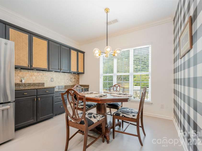43041 Mimosa Court, Fort Mill, SC 29707.  MLS# CAR4309711, YatesRealty ID 12955. Informal eating area in Kitchen. Peel & Stick wallpaper is easy to remove