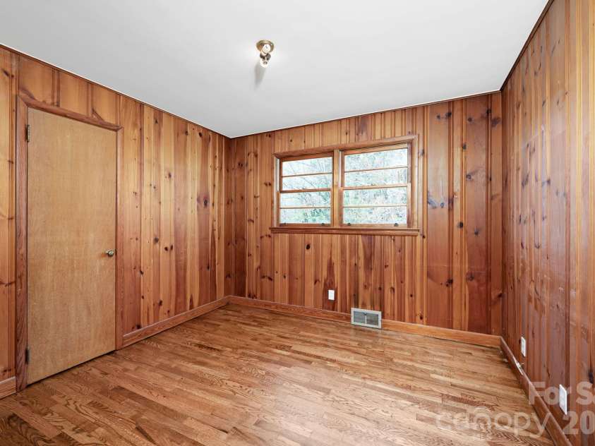 8 Pershing Road, Asheville, NC 28805.  MLS# CAR4364991, YatesRealty ID 12964. Second Bedroom with Real Wood Paneling