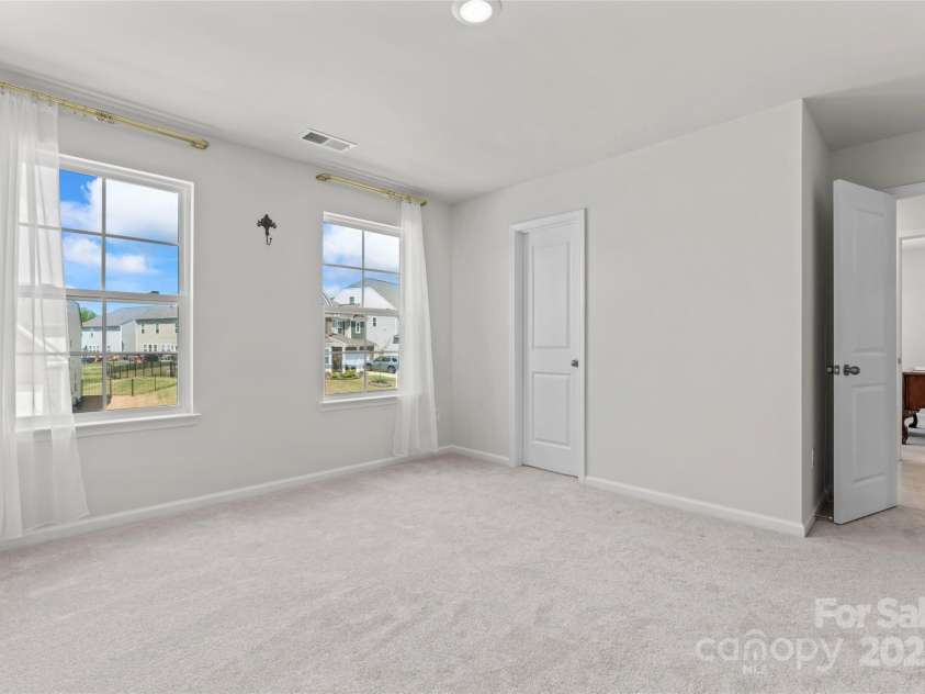 127 Doncaster Drive, Mooresville, NC 28115.  MLS# CAR4216362, YatesRealty ID 12968. Primary bedroom on second level