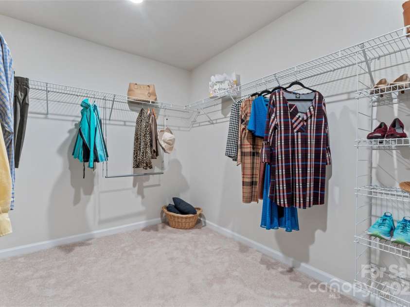 127 Doncaster Drive, Mooresville, NC 28115.  MLS# CAR4216362, YatesRealty ID 12968. Primary suite walk in closet