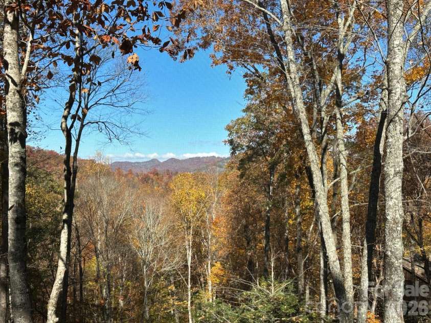 126 Mossycup Court, Tuckasegee, NC 28783.  MLS# CAR4324867, YatesRealty ID 12970. Fall Views from the Deck