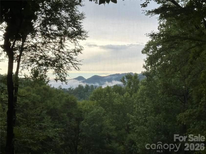 126 Mossycup Court, Tuckasegee, NC 28783.  MLS# CAR4324867, YatesRealty ID 12970. Summer Views from the Deck