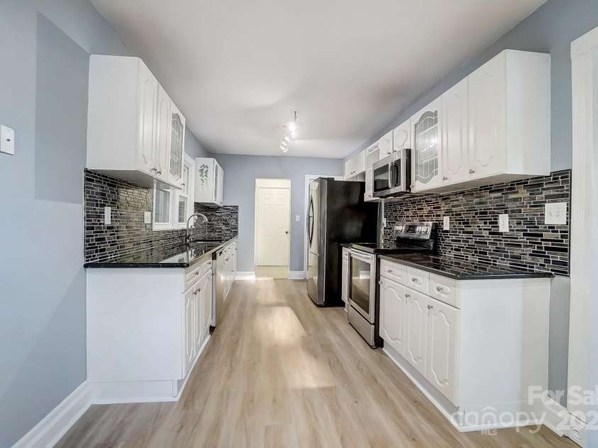 3703 Margaret Wallace Road, Matthews, NC 28105.  MLS# CAR4201589, YatesRealty ID 12974. 