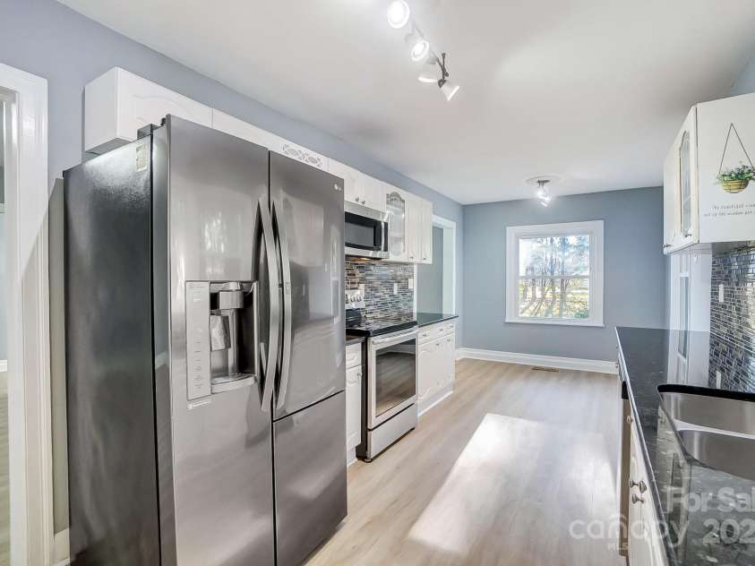 3703 Margaret Wallace Road, Matthews, NC 28105.  MLS# CAR4201589, YatesRealty ID 12974. 