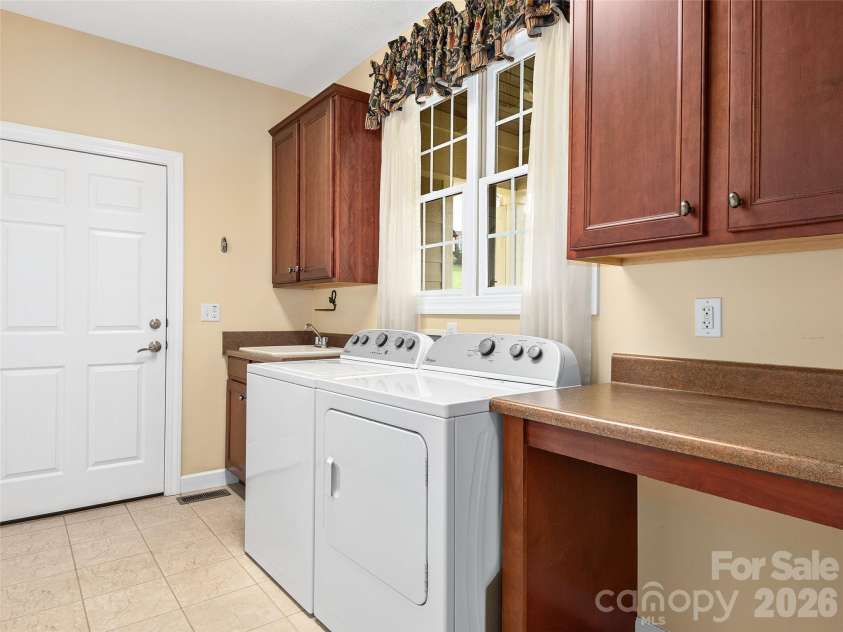 54 Deep Valley Lane, Hendersonville, NC 28791.  MLS# CAR4381596, YatesRealty ID 12976. Main-Level Laundry Room