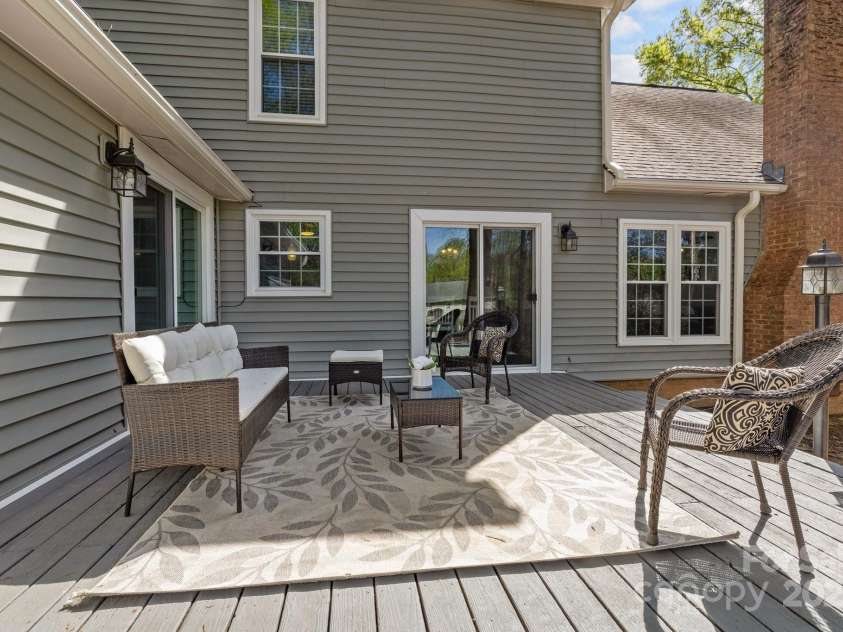 2439 Heathershire Lane, Matthews, NC 28105.  MLS# CAR4241970, YatesRealty ID 12981. Spending your days enjoying the sunshine on the deck!
