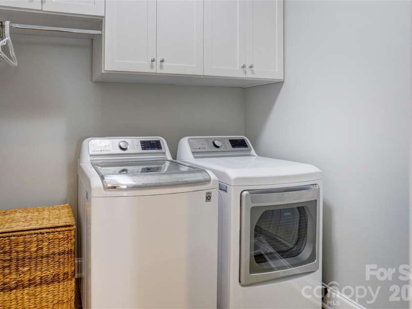 2663 Danbury Circle, Concord, NC 28027.  MLS# CAR4394399, YatesRealty ID 12988. The main level laundry room has been updated with new cabinets and drying area.