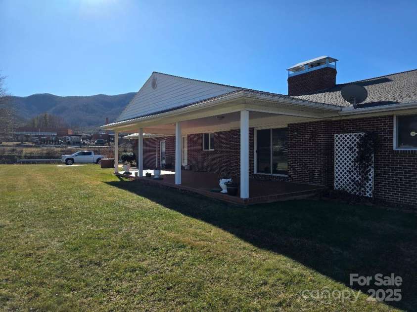 1375 US Highway 19E Highway, Burnsville, NC 28714.  MLS# CAR4329254, YatesRealty ID 1299. Covered patio at the rear of the house