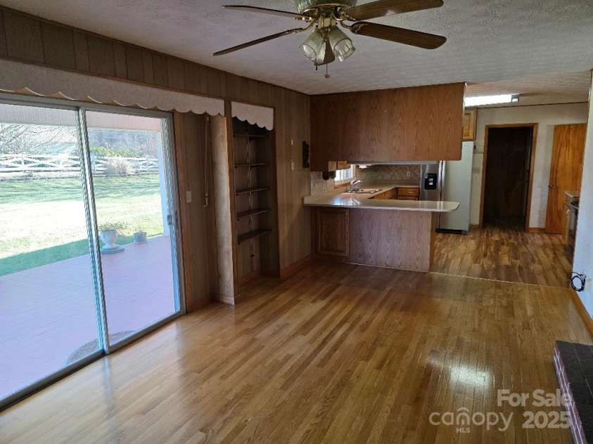 1375 US Highway 19E Highway, Burnsville, NC 28714.  MLS# CAR4329254, YatesRealty ID 1299. Den with sliding glass doors to the patio