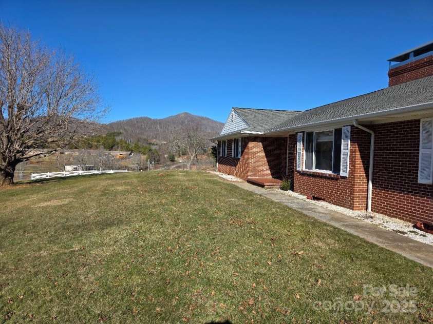 1375 US Highway 19E Highway, Burnsville, NC 28714.  MLS# CAR4329254, YatesRealty ID 1299. Front lawn