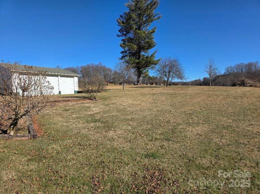 1375 US Highway 19E Highway, Burnsville, NC 28714.  MLS# CAR4329254, YatesRealty ID 1299. View looking east toward the cemetery