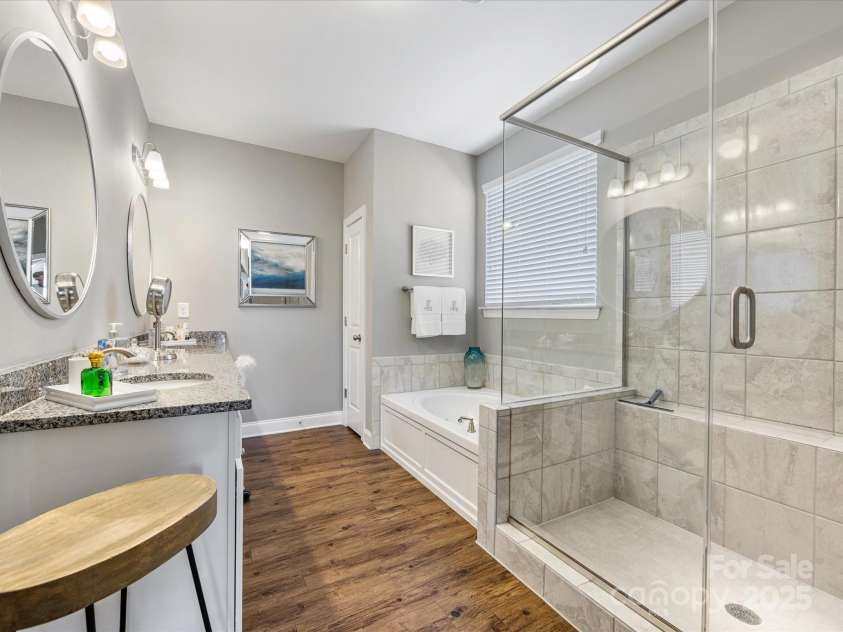 1022 Doughton Lane, Indian Trail, NC 28079.  MLS# CAR4234561, YatesRealty ID 12992. Large shower with bench. Soaking Tub.