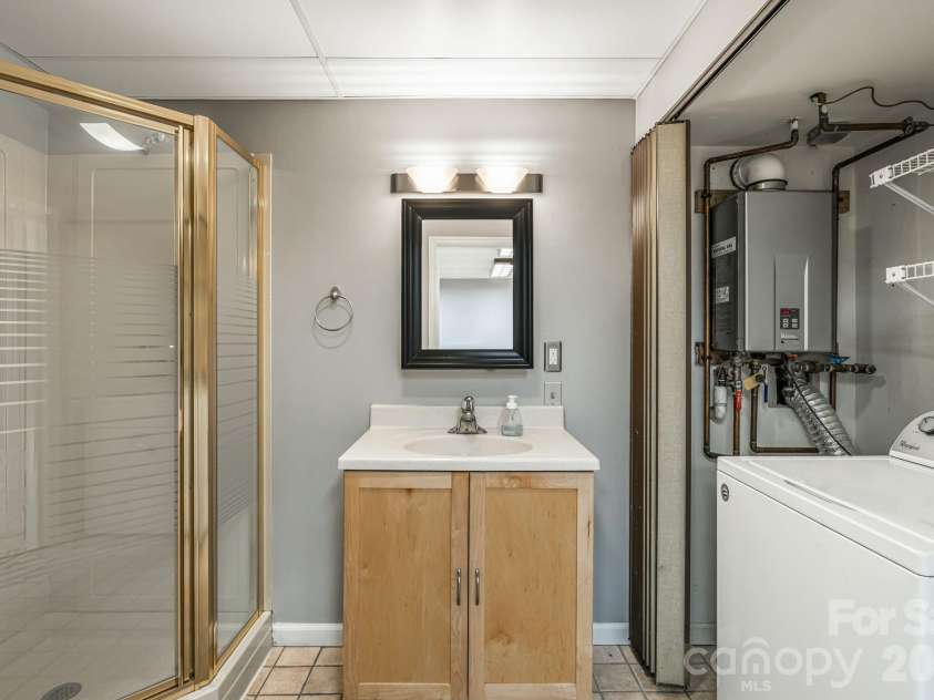 45 Windward Drive, Asheville, NC 28803.  MLS# CAR4341817, YatesRealty ID 12992. Lower level full bath and laundry