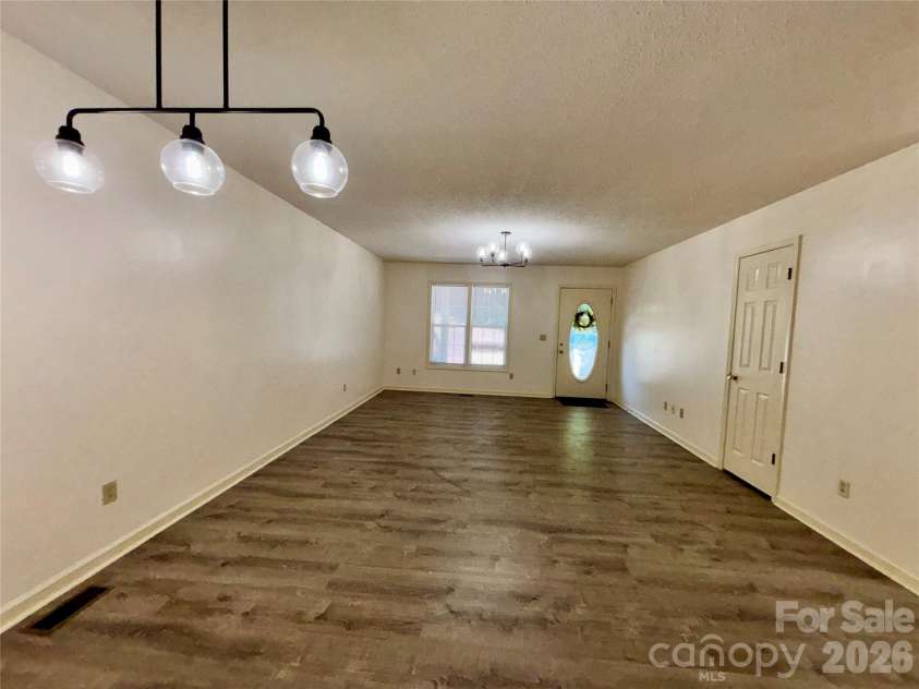 160 Whispering Pines Drive, Marion, NC 28752.  MLS# CAR4346254, YatesRealty ID 12995. Looking to the front door from dining area