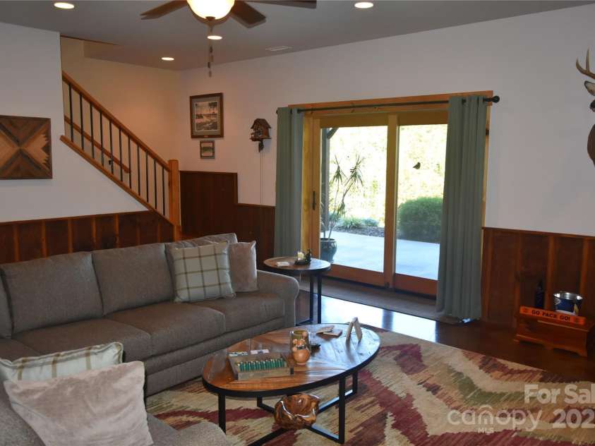 80 Grandview Loop, Nebo, NC 28761.  MLS# CAR4317495, YatesRealty ID 1300. Den, with patio access to the backyard.