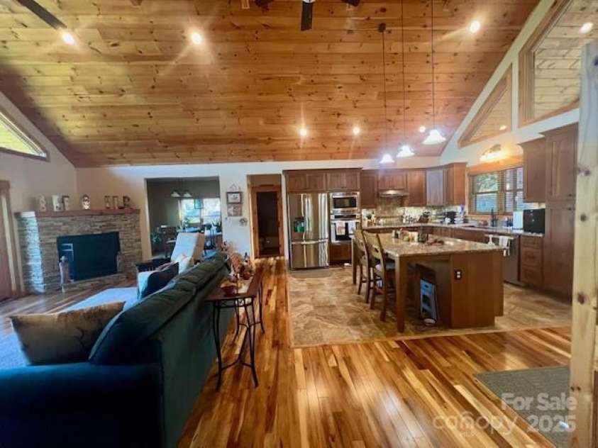 80 Grandview Loop, Nebo, NC 28761.  MLS# CAR4317495, YatesRealty ID 1300. Great room with kitchen and living room.